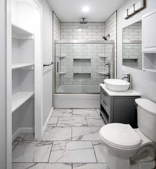 bathroom remodel with white subway tile shower and marble tile floor in Westerville, Ohio